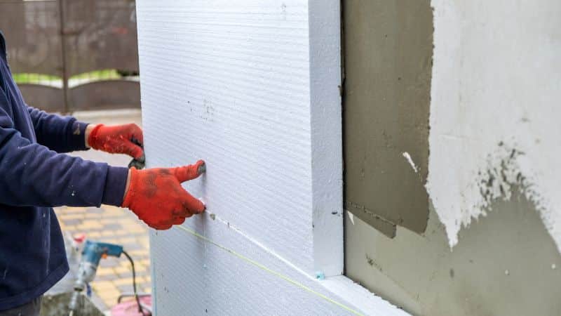 Man working on a wall cladding 