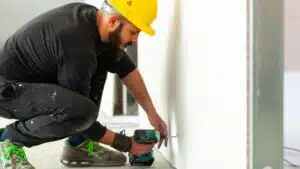 Man working on a wall panel